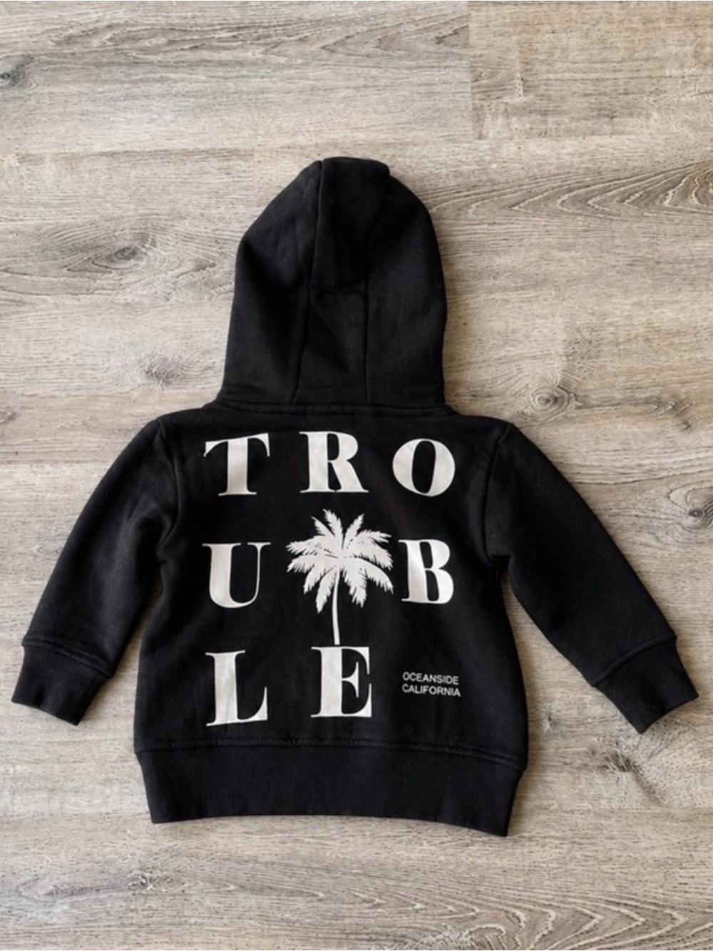 Little Trouble Baby Hoodie
6-12M Black Skull Palm Graphic
Pullover NWT